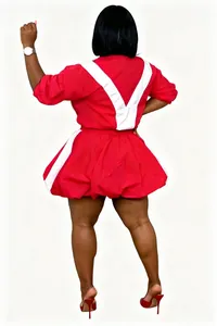 Back view of a stylish red and white color block two-piece set with a bubble skirt