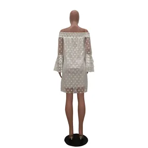Back view of a white off-shoulder polka dot dress with layered bell sleeves