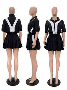 Front, side, and back views of a black and white color-block sporty bubble skirt set.