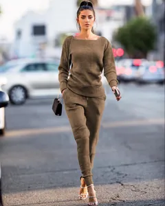 Full length view of a woman wearing a brown ribbed knit two-piece set on a city street