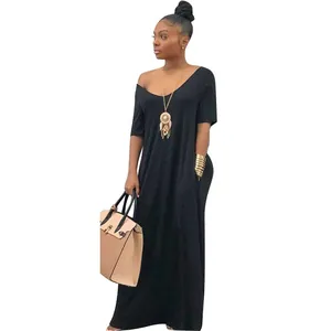 Close-up of elegant black short sleeve maxi dress with loose shoulder and pockets