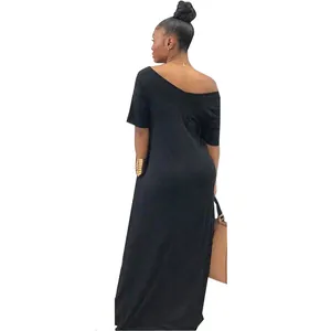Back view detail showing the silhouette of a black off-shoulder short sleeve maxi dress