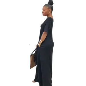 Side view of a solid black short-sleeve maxi dress with pockets and loose fit