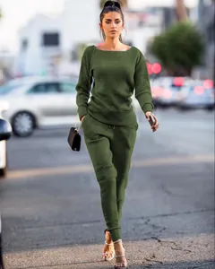 Detailed view of women's olive green ribbed two-piece leisure set in street setting
