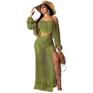 Detailed shot of green crochet mesh beach set featuring off-shoulder top and fringe