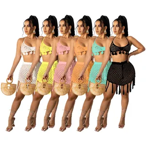 Two-piece crochet knit bikini set with tassel skirt available in multiple summer colors
