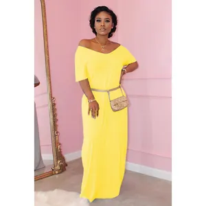 Close-up detail of vibrant yellow short sleeve maxi dress with an elegant off-shoulder neckline
