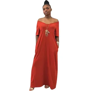 Elegant solid orange loose maxi dress with short sleeves and pockets worn by model