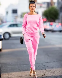 Outdoor street shot of a pink ribbed knit leisure two-piece set for women