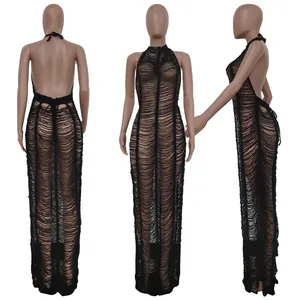 Detailed view of a sexy black knitted beach maxi dress featuring a shredded fringe texture