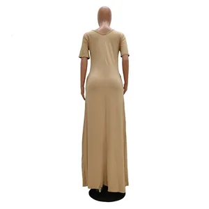 Full length back view of a beige casual short sleeve maxi dress on a mannequin.