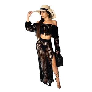 Chic black crochet mesh two-piece beach set with tassels and a high-slit long skirt