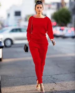 Detailed view of red ribbed long-sleeved top and matching pants set on a model