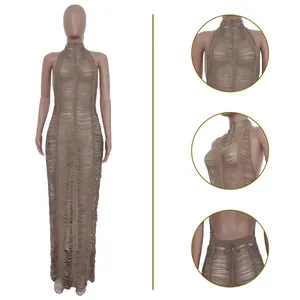 Close-up details of sexy brown knitted hollow-out beach maxi dress on mannequin