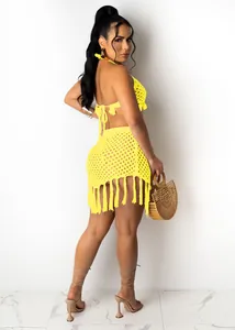 Detailed side view of a yellow crochet mesh bikini set with fringe mini skirt