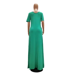 Detailed back view of a casual green short-sleeved maxi dress shown on a tall mannequin