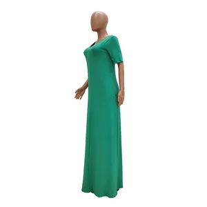 Elegant vibrant green short sleeve maxi dress for women shown from a side view angle