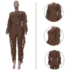 Detail view of brown knitted two-piece set featuring fringe accents and textured pattern