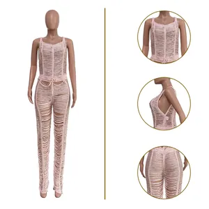 Detail views of a sexy pink knitted hollow-out jumpsuit with distressed texture