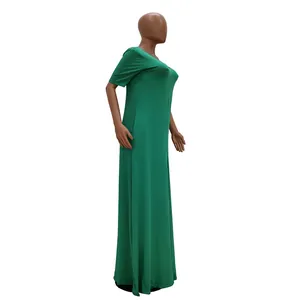 Side view of a vibrant green short sleeve casual maxi dress featuring functional pockets