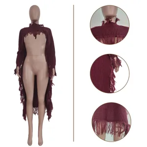 Detailed view of wine red knitted sweater showcasing intricate long fringe on collar and hem.