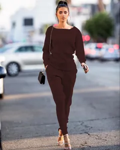 Elegant dark brown knitted two-piece set for women featured in an urban street style shot