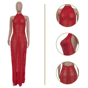 Detailed view of a sexy red knitted halter beach maxi dress showing intricate fabric texture.