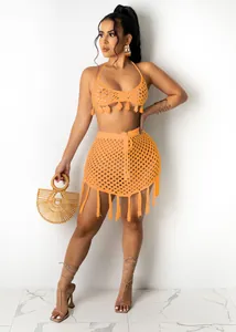 Detail shot of orange crochet knit bikini two-piece set for beachwear and holidays.
