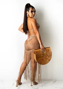 Elegant beige crochet two-piece beach set featuring a sexy long fringe skirt detail