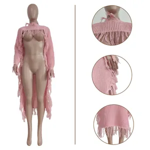 Detailed view of pink long-sleeved knitted sweater featuring stylish fringe accents