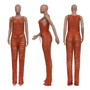 Front, side, and back views of a sexy orange knitted hollow-out beach jumpsuit for women