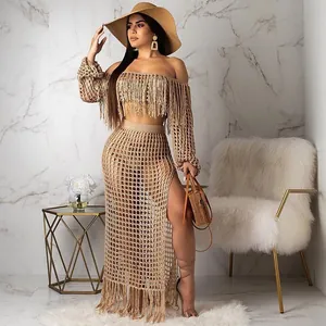 Full view of women's beige crochet two-piece set with mesh and fringe details