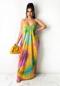 Full body view of a vibrant tie-dye cotton spaghetti strap maxi dress on a model