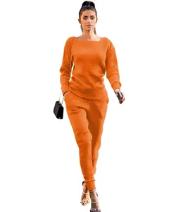 Stylish orange two-piece knit set featuring long-sleeved sweater and matching joggers