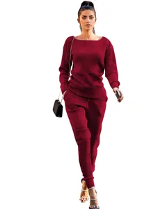 Full view of stylish burgundy ribbed knit long-sleeve top and pants set for women