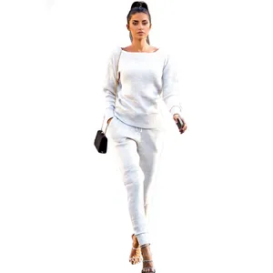 Full view of light gray ribbed knit tracksuit set on model with white background