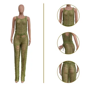 Detailed view of green sexy hollow-out knitted jumpsuit for women on a mannequin.