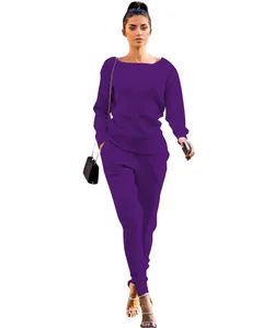 Detail view of a purple knitted two-piece set for women with long sleeves and pants.