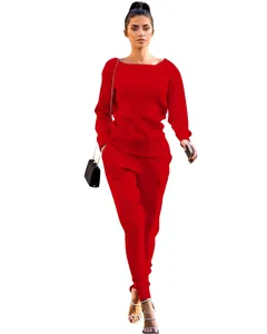 Full-body view of a vibrant red two-piece knitted sweater and pants set for women