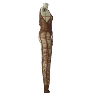 Detailed side view of a sexy brown knitted hollow-out jumpsuit for beach and clubwear