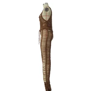 Side profile view detail of a sexy brown hollow-out crochet knitted jumpsuit on a mannequin