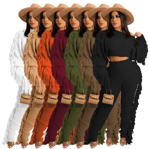 Chic women's solid knit two-piece set featuring long sleeves and dramatic fringe detail.