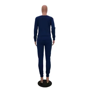 Back perspective of women's navy blue urban casual two-piece set with long sleeves