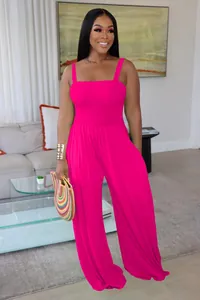 Vibrant pink smocked wide-leg jumpsuit for women, sleeveless casual style detail view