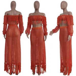 Detailed view of orange mesh crochet beach set with tassels and off-shoulder long sleeve top