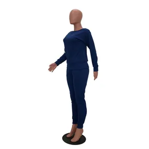 Side profile view of a navy blue two-piece casual long sleeve loungewear set for women.