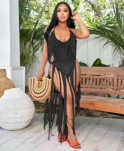 Detailed view of a sexy black crochet one-piece swimsuit with dramatic long fringes