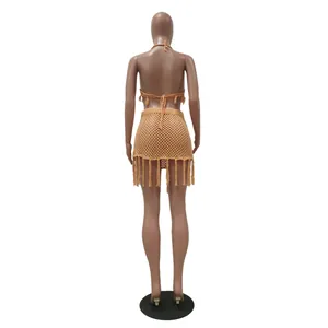 Back view of tan knit mesh crochet bikini set with fringe tassel skirt for beach