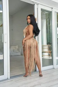 Detailed back view of a sexy tan crochet monokini featuring extra long tassel fringe