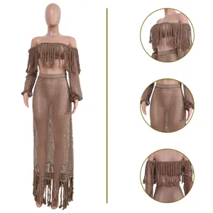 Detailed view of women's mesh fringe beach set including crop top and long skirt